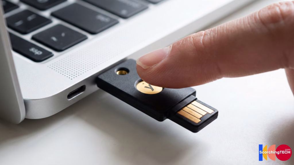 User authenticating with a YubiKey 5C NFC hardware security key on a laptop.